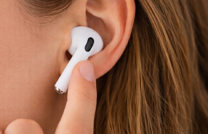 Pressing AirPods Pro stem to switch noise control modes