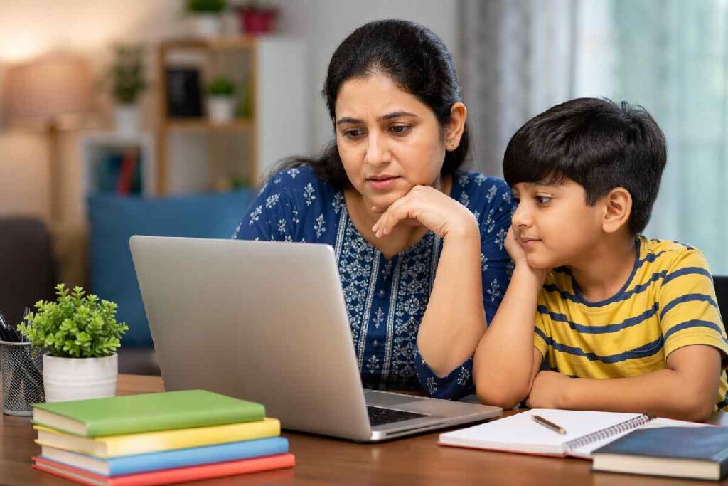 Parent checking children learning app online with child at home